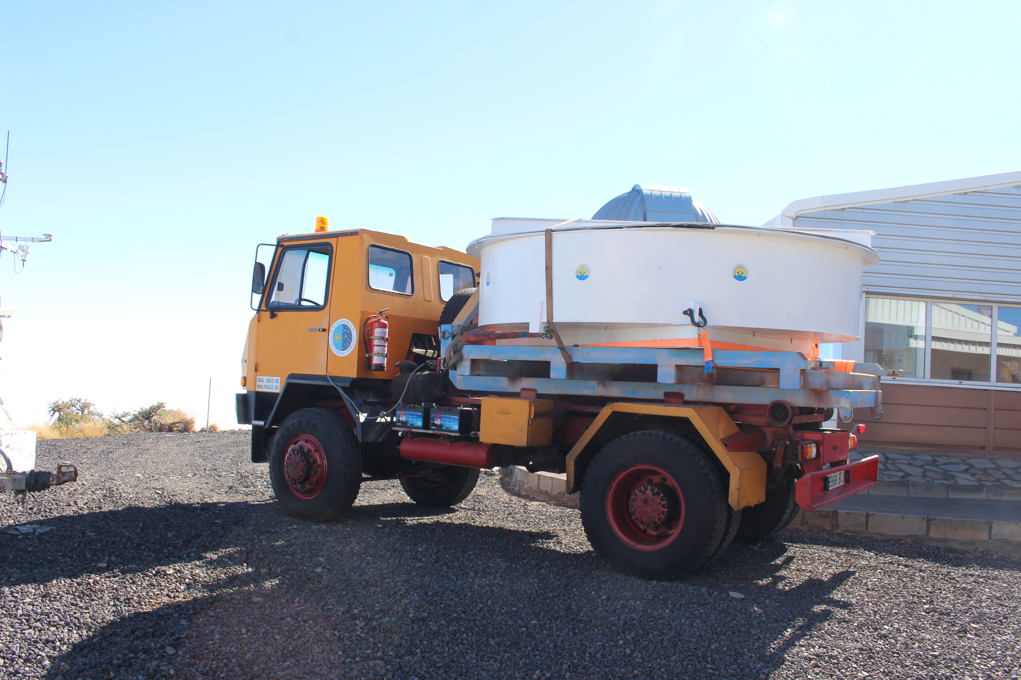 Photo of a truck carrying the LT mirror up the mountain